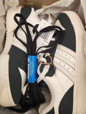Adidas White and Black Low-Top Sneakers with Classic Three Stripes